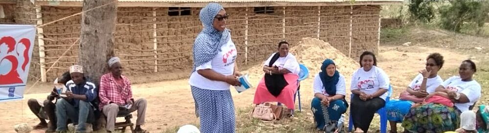 Immaculate Mungai, Chairperson of the Kwale Women of Faith Network, leading a community sensitization session on women and children's rights in Kinango, Kwale, Kenya.