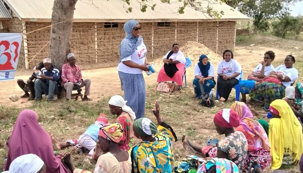 Immaculate Mungai, Chairperson of the Kwale Women of Faith Network, leading a community sensitization session on women and children's rights in Kinango, Kwale, Kenya.